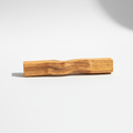 Single Palo Santo wood stick on a clean white background