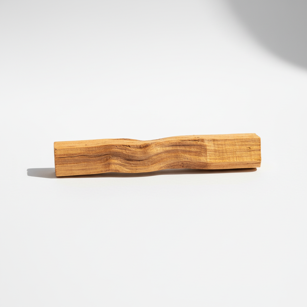 Single Palo Santo wood stick on a clean white background